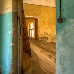 Namib desert sand reclaiming the the once thriving diamond town of Kolmanskop