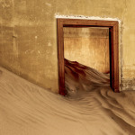 Namib desert sand reclaiming the the once thriving diamond town of Kolmanskop