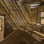 Namib desert sand reclaiming the the once thriving diamond town of Kolmanskop