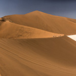 A panorama of the orange sand dune Big Daddy and the clay pan of Deadvlei
