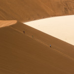 Descending the slope of Big Daddy to Deadvlei on the desert floor