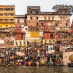 Early morning Hindu prayers and rituals with numerous palaces and temples in the background