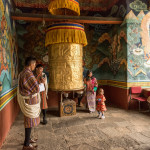 Bhutanese family, prayer wheel, Bhutan